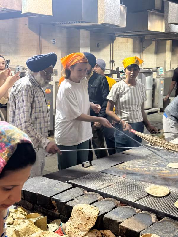 Delhi Private Tour - Our clients serving in Sikh temple.