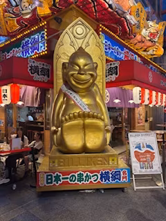 Osaka Private Tour - Billiken is a charm doll and good luck deity