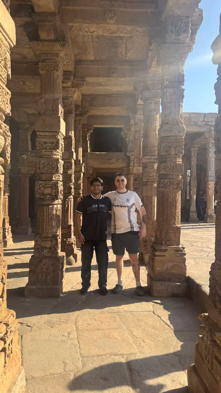 Delhi Private Tour - Exploring the 800-year-old mosque in the Qutub Minar complex with Dan from England — a stunning blend of Indo-Islamic architecture and ancient craftsmanship.