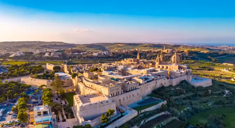 Malta Private Tour - Mdina, the Silent City**, is a medieval walled town in Malta, known for its **historic charm** and **panoramic views**. Once Malta’s capital, it features **narrow streets, grand palaces, and St. Paul’s Cathedral**. From above, its fortified walls and golden limestone buildings create a breathtaking sight.