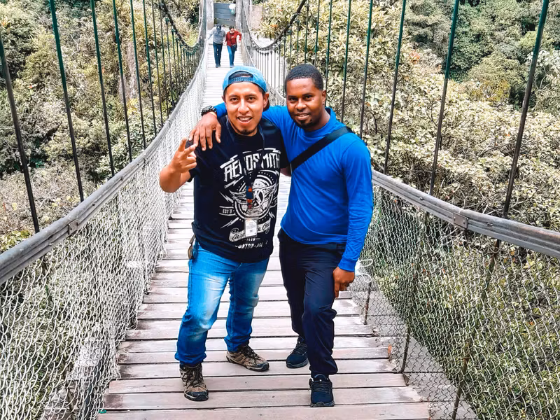 Carchi Private Tour - Marco in bridge in Baños with friend