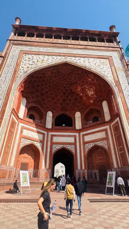 Delhi Private Tour - Standing before the Grand Gate of the Taj Mahal — where every arch frames a love story carved in stone.